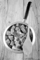 beef stew in a pot and a wooden spoon