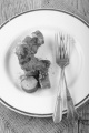 curried sausage on a old plate with fork