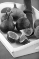 sweet fig and knife on a white serving tray
