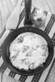 mediterranean omelette in a pan with olive oil and spatula