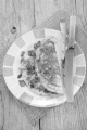 warm omelette with bacon and chive on a plate