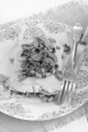 lasagne with mushrooms, cottage cheese and basil on a plate