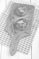 two potato cake with rosemary on wooden board