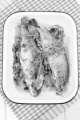 grilled mushroom stuffed trout with thyme in a blue and white enamel  bowl  