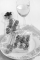 mediterranean flat bread with cherry tomato, olive and thyme on a plate