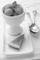 fresh water melon with mint in a white bowl and spoon