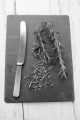 fresh organic rosemary and knife on slate