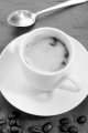 espresso coffee in a small white cup on slate