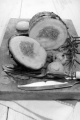 pork belly roll with minced meat and rice filling on a wooden board