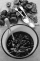fresh plum jam with spoon in an enamel bowl