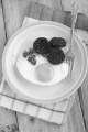 black pudding and fried egg on british breakfast muffin