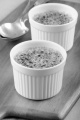 creme brulee and spoon on wooden board