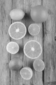 citrus fruit, orange, lemon and lime on rustic wood