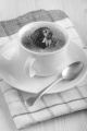 creme brulee with strawberry in a white cup