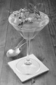 cold dessert with chocolate mousse, whipped cream and mousse from the sharon fruit sprinkled with chocolate curls