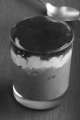 chocolate mascarpone dessert with strawberry mousse in a shot glass on slate