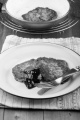 irish raisin boxty with plum jam and mint on a plate