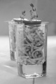 sweet chilli noodle appetizer with thyme and tomato in a shot glass