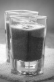 green smoothie made from celery, cabbage and bananas on jute in a shot glass