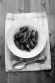 warm mussel with tomato chorizo sauce on a plate