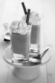 chocolate dessert with whipped cream and sweet chocolate sticks