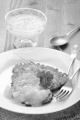 potato pancake with bramley apple sauce and parsley on a plate