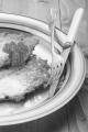 potato pancake with sugar and parsley on a plate