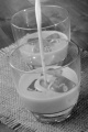 irish cream made from whiskey and cream in a glass with ice cubes