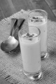 cream of mushroom soup with thyme in a shot glass on jute 