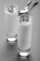 cream of chicken soup with parsley in a shot glass on slate