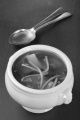 asian miso soup in a white bowl on slate with spoon