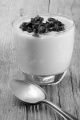 strawberry mousse and vanilla pudding in a glass with dried cranberries