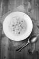 creamy potato leek soup in a soup dish with thyme 