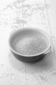 bowl on white wood filled with organic millet