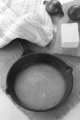warm melted butter in a cast iron pan