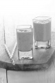 strawberry milk shake in a shot glass with straw