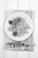 noodles with grilled wild salmon, tomatoes and rosemary on a plate